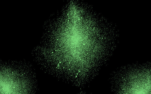 Main green spray explosion in the center with two smaller green splashes in the bottom corners on a black background.Vibrant Green Spray Splatter Pattern on Black Background