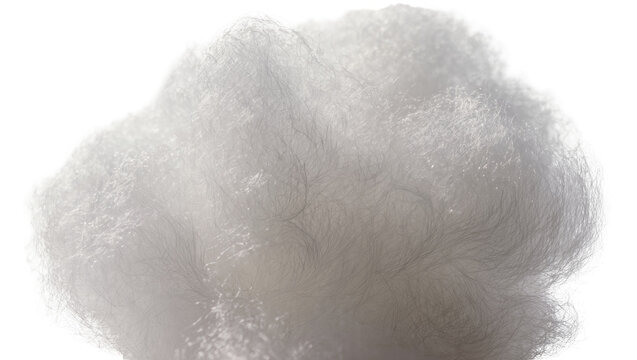 Isolated fluffy white synthetic fibers for filling, soft texture and intricate detail close-up macro shot