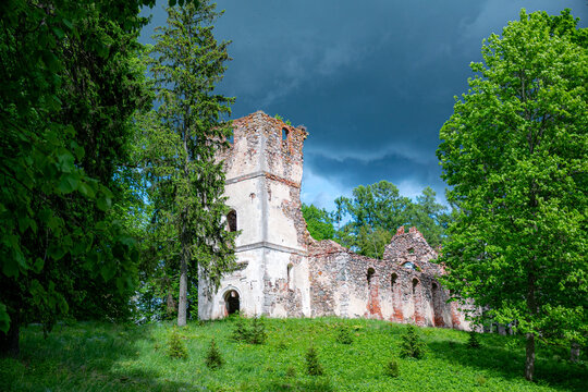 Sunny landscape with old stone church ruins, The church was a brick building with a rectangular chancel and a protruding tower with a baroque spire.