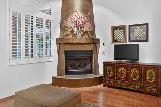 Cozy living room with fireplace and decorative cabinet