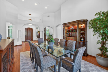 Elegant dining room with glass table and chairs