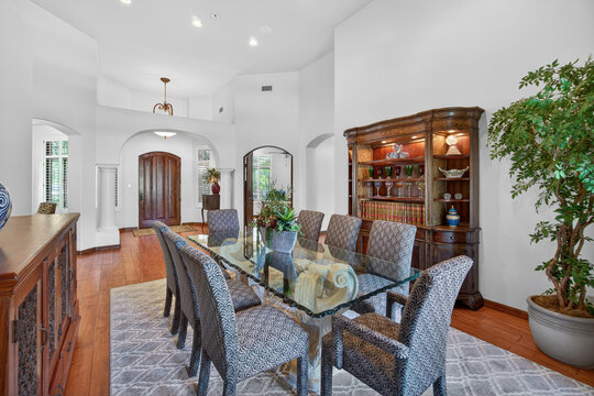 Elegant dining room with glass table and chairs