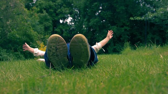 Woman lying down relaxing in garden lawn