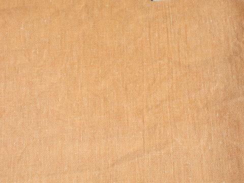 Orange cotton fabric texture with plain weave pattern