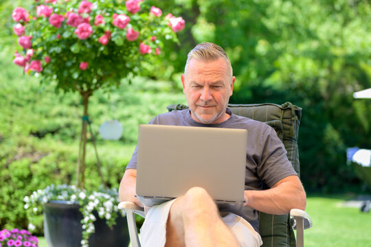 Focused Freelancer Working Outdoor Remotely