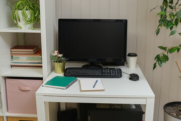 Fototapeta premium Orderly workspace setup. Organized desk, work from home concept. Remote office station with laptop display, keyboard, paperwork. Work place for distance working. Tidy table with monitor and printer
