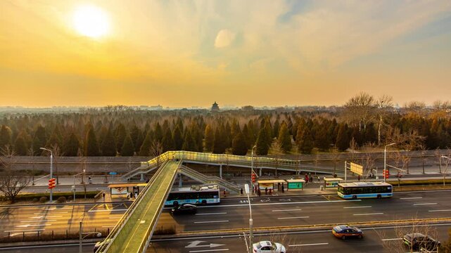 Pedestrian Overpass Above Busy Road at Sunset