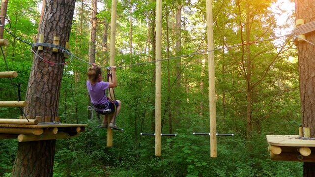 Small girl with helmet in adventure park