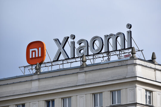 Xiaomi company office with signage, logo, emblem on the facade. Chinese multinational corporation. WARSAW, POLAND - APRIL 30, 2026