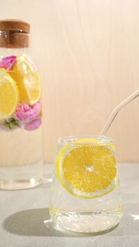 Close-up of a glass of lemon water with air bubbles