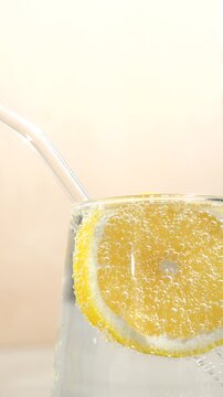 Macro of air bubbles in pure carbonated water with lemon