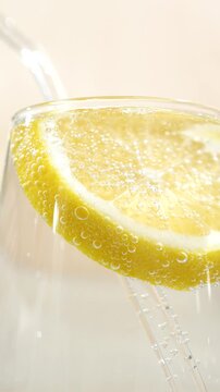 Macro of air bubbles in pure carbonated water with lemon