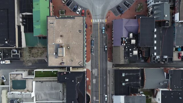 Roundabout district view centers on Lincoln Square linking Baltimore Street, Carlisle Street, Chambersburg Street with dense commercial facades. Mixed roofing, HVAC units emphasize tight, PA