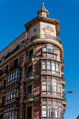 Ornate bilbao building corner featuring traditional architecture details © kalama