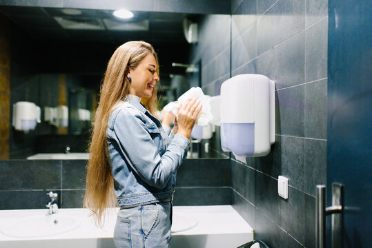 Customer Drying Hands Using Soft Paper Towels