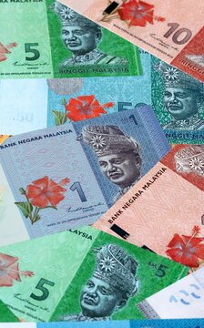 Malaysian ringgit money bills in pile on table. Malaysia MYR currency cash close up
