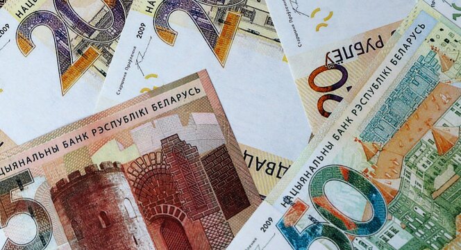 Belarusian ruble money bills in pile on table. Belarus BYN currency cash close up