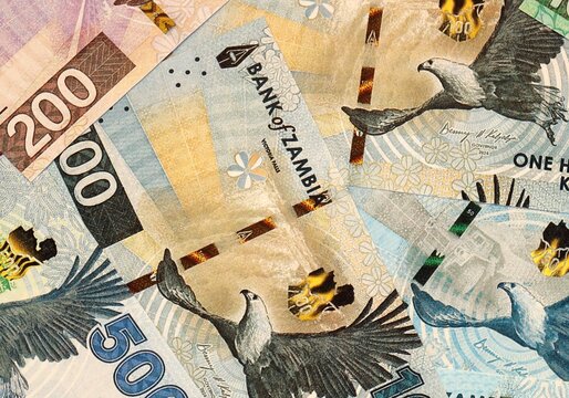 Zambian kwacha money bills in pile on table. Zambia ZMW currency cash close up