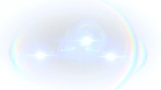 Panning shot of bright lens flare highlights drifting across white background with radial light rings and rainbow chromatic aberration
