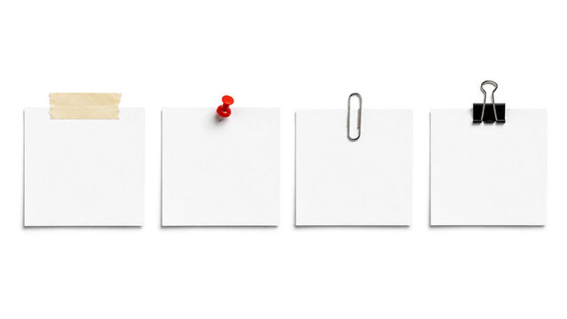 Four blank white sticky notes with office supplies on a plain background