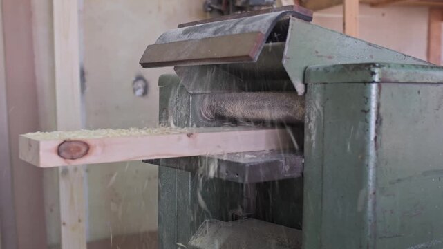 Timber going through a thickness planer