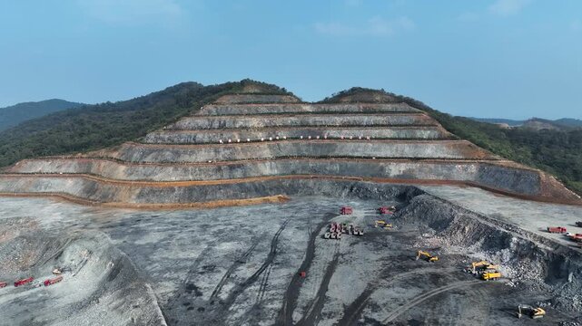 Open Pit Mining Site in Mountainous Landscape