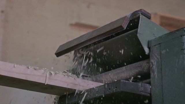 Timber going through a thickness planer