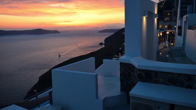 Fira, Greece - 11.06.2026: Colorful sunset sky over Santorini caldera with whitewashed buildings and Aegean Sea coastline at dusk.