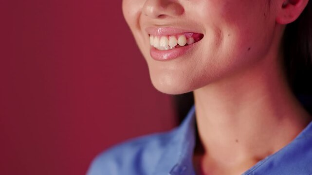 Smiling Young Woman With Dimples, Showing Happiness And Positivity At Studio Setting, Wearing Blue Shirt And Exuding Cheerful Energy. Ideal For Lifestyle And Beauty Concept.