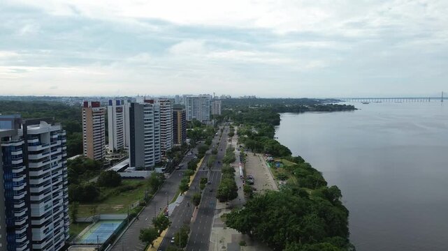 Cinematic Aerial View of Ponta Negra and the Amazon River in Manaus, Brazil