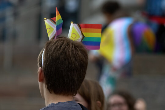 Person wearing lgbtq pride flags headband at event