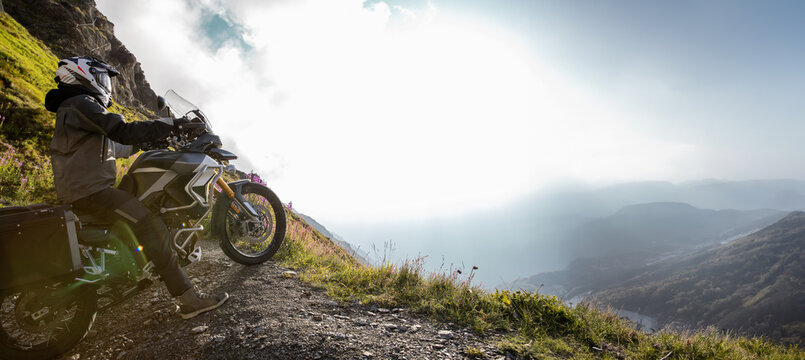 Close-up of motorcycle rider on europe mountains
