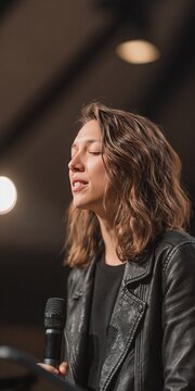 Photo of female pastor giving sermon