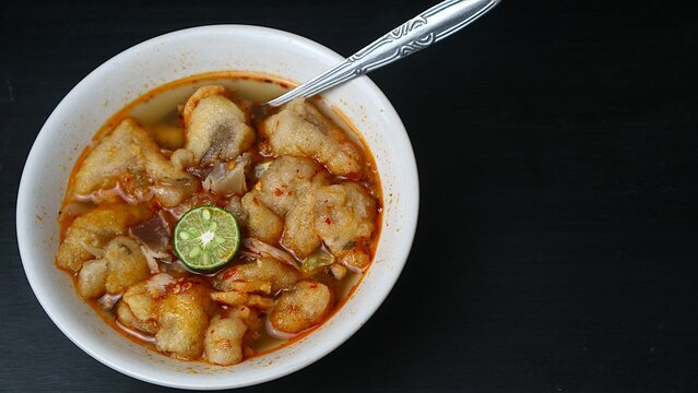 Indonesian Baso Aci with Cuanki and Lime in a White Bowl on Black Background