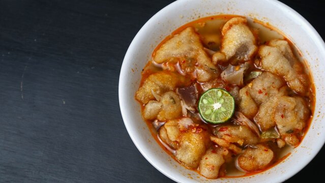 Batagor Kuah, Traditional Spicy Indonesian Fried Dumplings Served in a Savory Broth with Lime