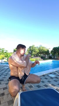 Man Pointing Out No Smoking Rule at Poolside
