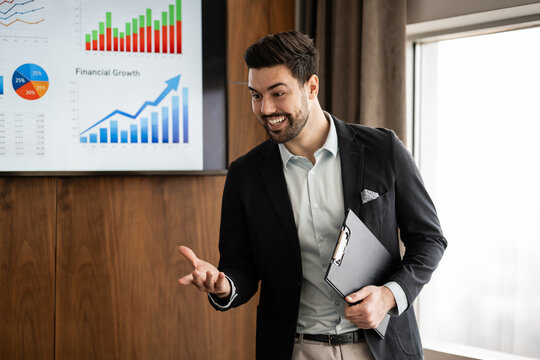 Business speaker presenting financial growth data during a corporate meeting