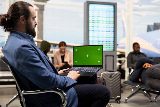 Isolated screen on laptop near adult man working in airport terminal, reviewing job tasks during business travel.
