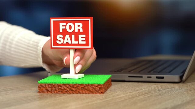 A plot of land is for sale. The plot area has a green lawn and a For Sale sign. Real estate opportunities support investment, development and property ownership