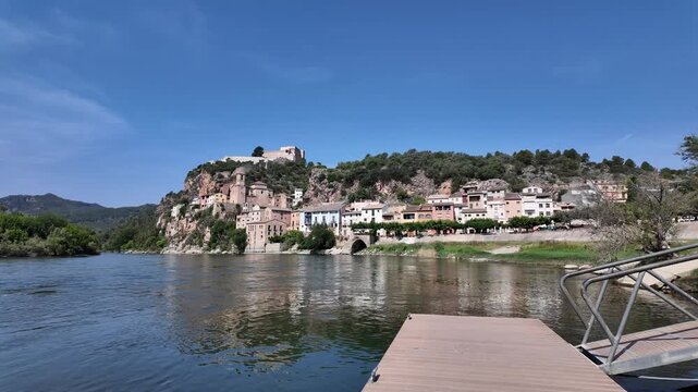 Miravet village and templar castle perched on a hill above the ebro river