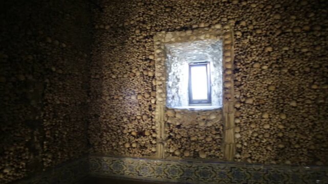 Evora, Portugal - August 18, 2017: The Capela dos Ossos or Chapel of Bones is a fascinating chapel with a macabre atmosphere in Evora city. This small chapel is the resting place in the 16th Century.