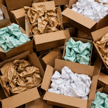 Cardboard boxes with crumpled paper inside for packaging goods from online stores, eco friendly packaging made of recyclable raw materials