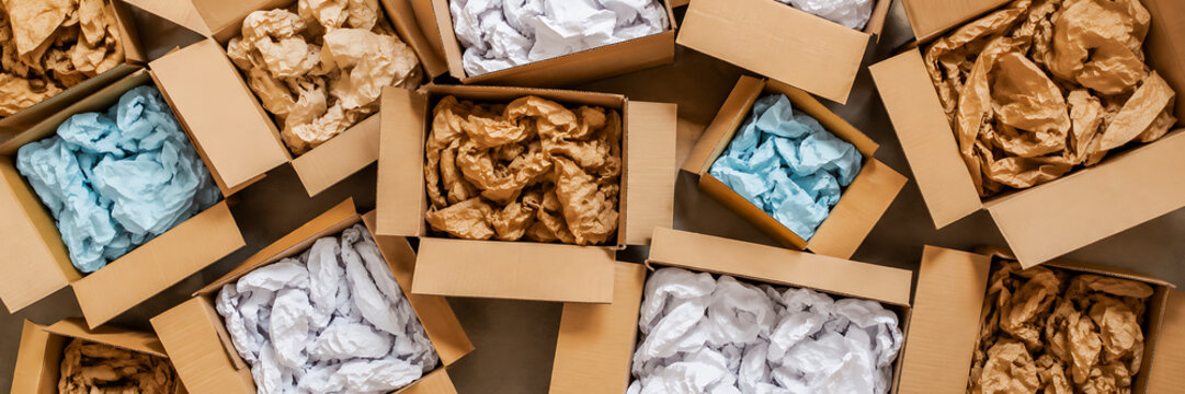 Cardboard boxes with crumpled paper inside for packaging goods from online stores, eco friendly packaging made of recyclable raw materials