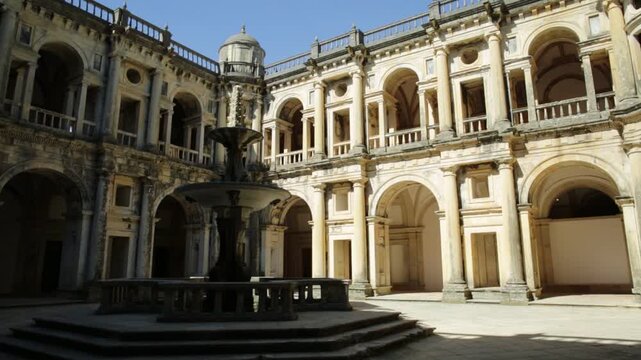 Tomar, Portugal - August 10, 2017: Bottom view of claustro de D. Joao III, courtyard with fountain of Convent of Christ in Templar Castle. Unesco Heritage and popular destination in Europe.