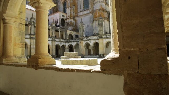 Tomar, Portugal - August 10, 2017: perspective view pov of the double porch inside Claustro da Hospedaria or Guests in Templar Castle of Tomar or Convent of Christ. Unesco Heritage and popular place.