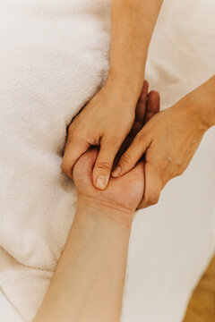 Close up of hand massage therapy session. Female massage therapist's hands.