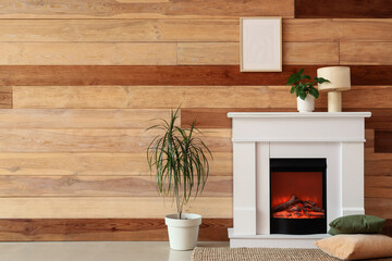 Obraz premium Modern living room interior with white fireplace, houseplants, and wooden plank wall decor for home comfort