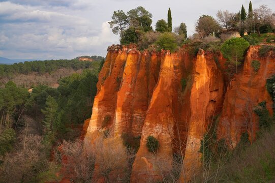 View of red and yellow ochre cliffs outside the town of Roussillon in Vaucluse, Provence, France