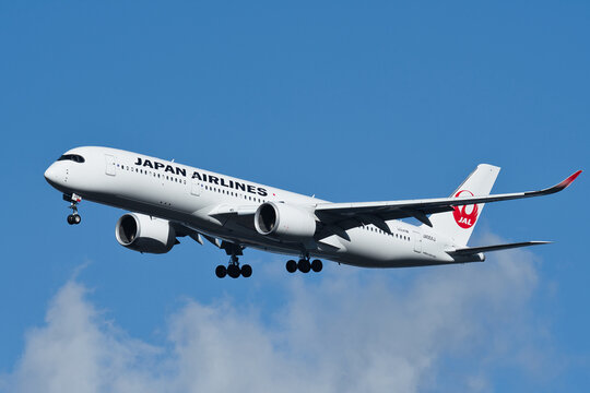 Japan Airlines Airbus A350-900 (JA05XJ) on final approach to Haneda Airport under a blue sky