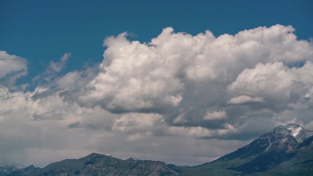 Clouds moving in timelapse over mountains in the Wasatch front in Utah.